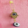 Evil Eye Safety Pin Brooch with Hand Design – Spiritueller Schutz