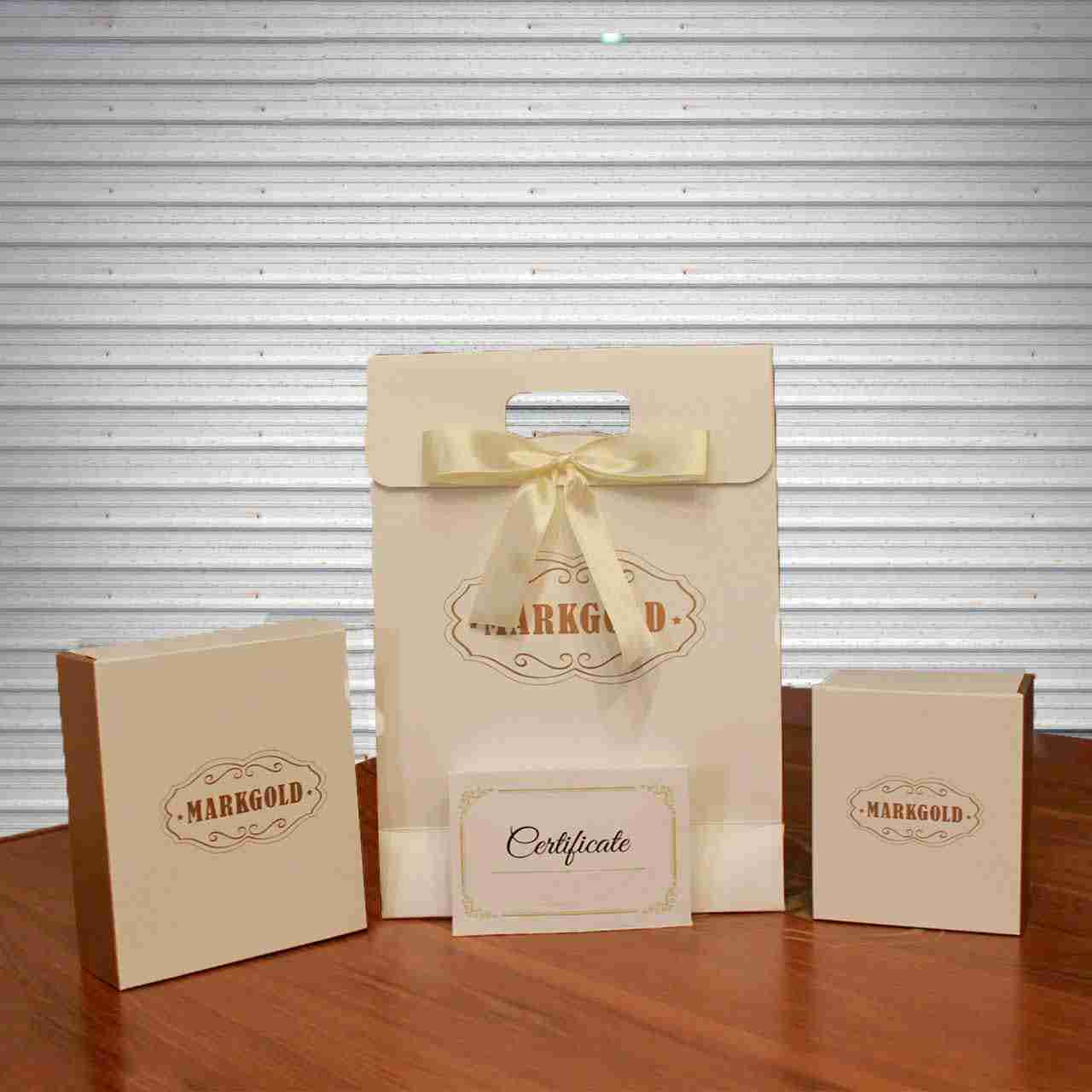 Goldplattierte Ohrringe mit Mordad-Symbol