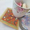 Handgewebter persischer Woll-Kilim-Untersetzer mit geometrischem Design
