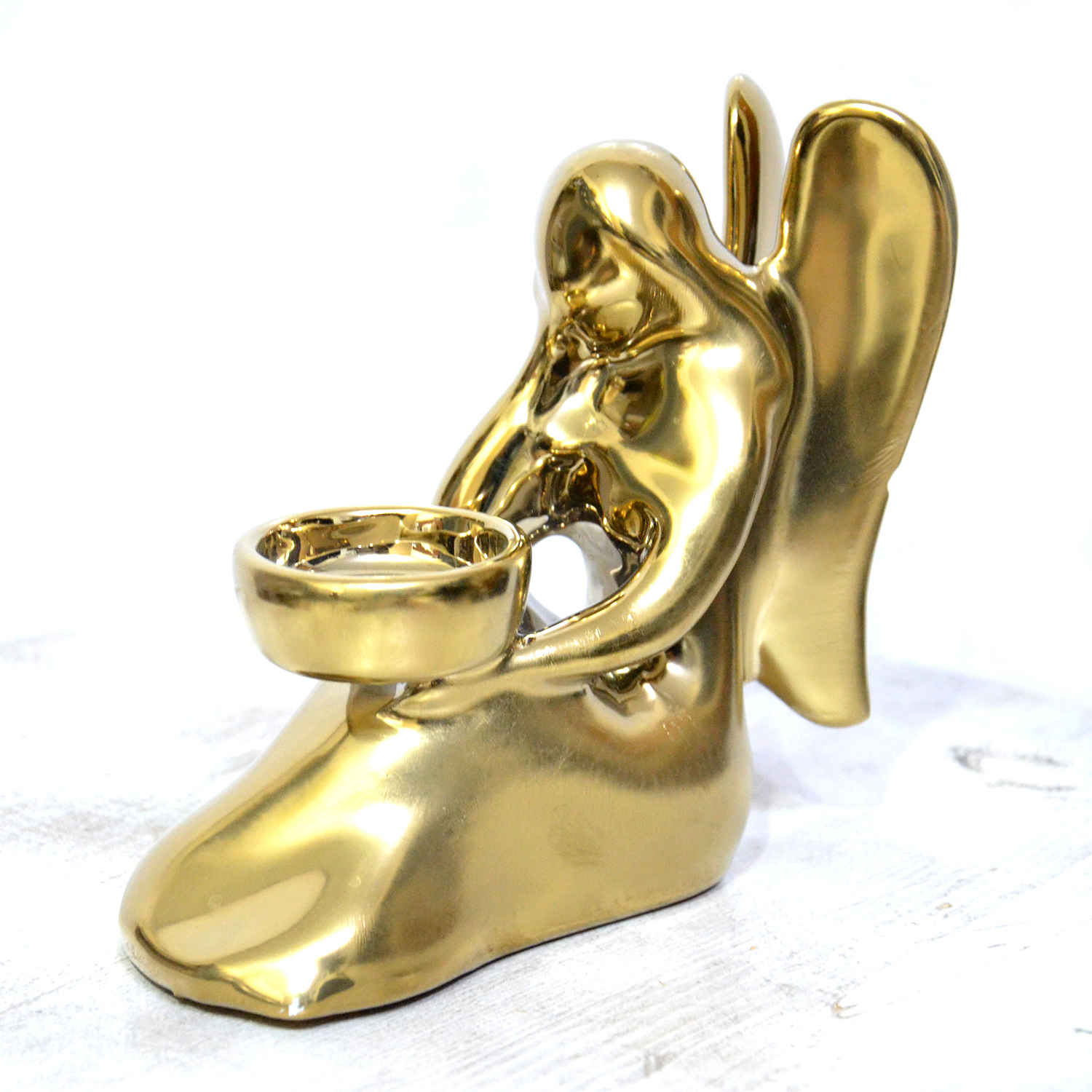 Dekorativer Kerzenhalter aus Keramik im schicken Engel-Design in Gold