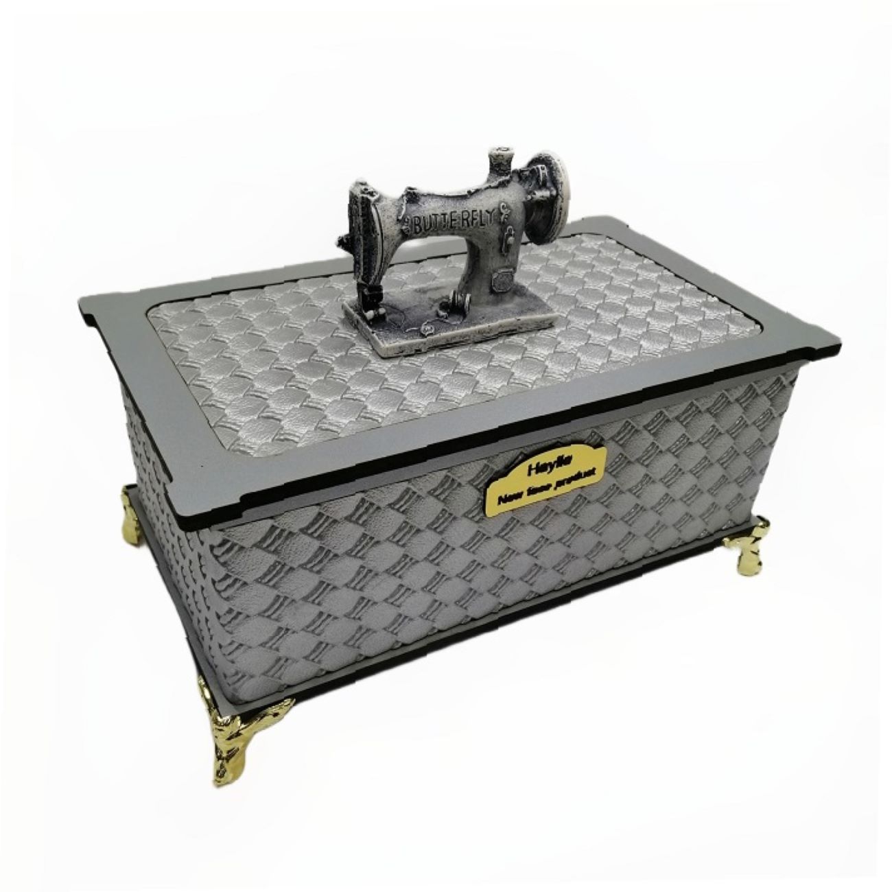 Nähkasten aus Holz mit Kunstlederbezug und Nähwerkzeugen.