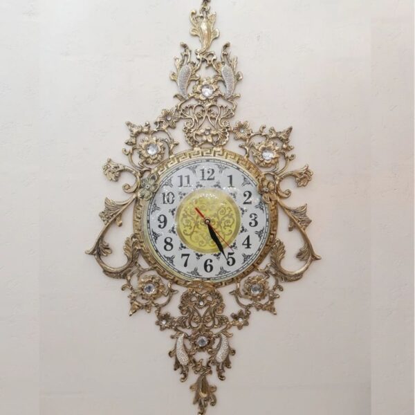 Luxurious-Brass-Wall-Clock-Featuring-a-Delicate-Floral-Hanging-Accent